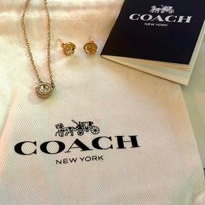 Coach rose gold bracelet and necklace combo with dust bag and care booklet.